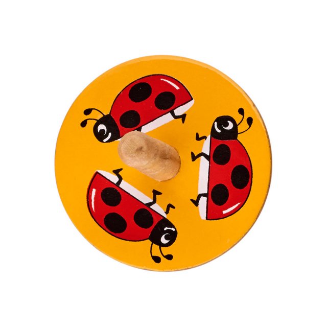 a birds eye view of a yellow spinning top with a design of three red ladybirds