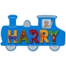 Small, flat wooden name plaque in blue train design with Harry spelt in multicoloured letters