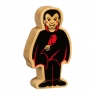 A chunky wooden black and red toy vampire figure in profile with a natural wood edge
