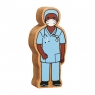 A chunky wooden blue nurse in scrubs toy figure with a natural wood edge