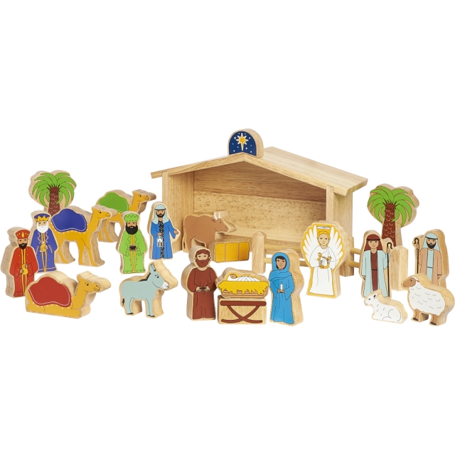 Wooden nativity playset with barns and characters in situ slightly angled view