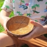 Coconut bowl with water held by child