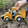 Wooden yellow digger toy car with driver being pushed by childs hand